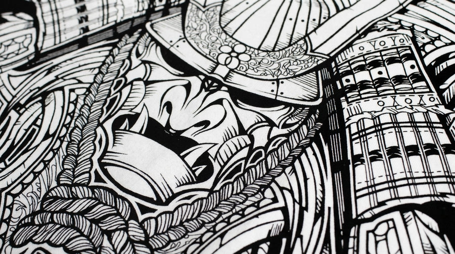 Black Pigmento ink screen-printed on a white tee — intricate samurai linework with every hairline crisp and fully opaque
